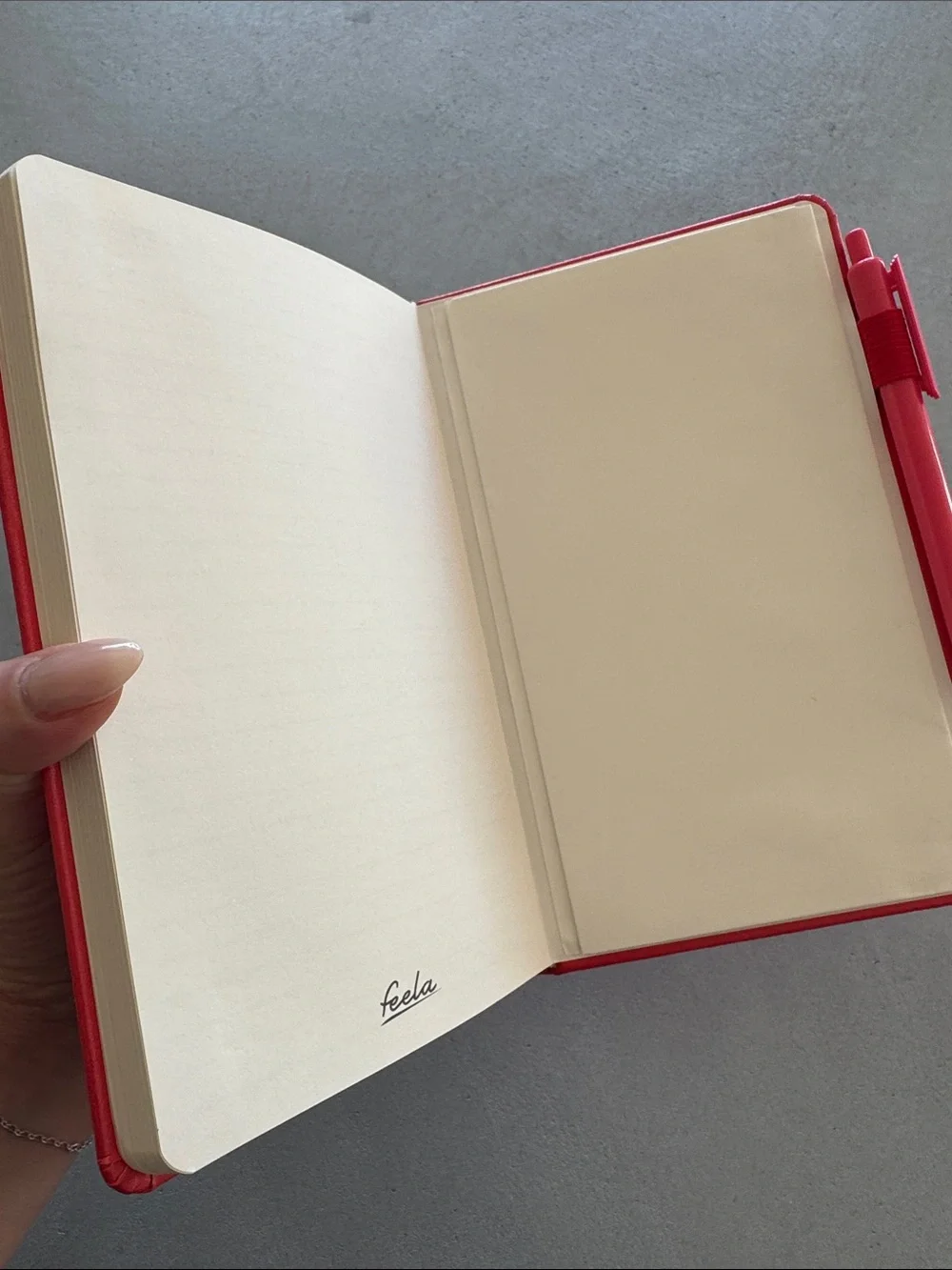 NWOT FEELA CORAL/RED HARDBACK NOTEBOOK WITH PEN